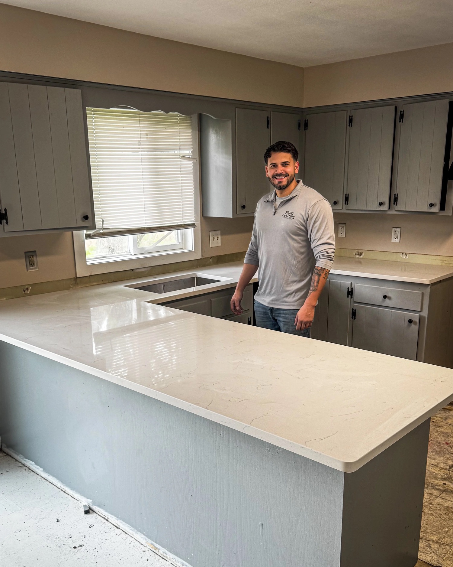 Enrique, Q&R owner, at a kitchen countertop
